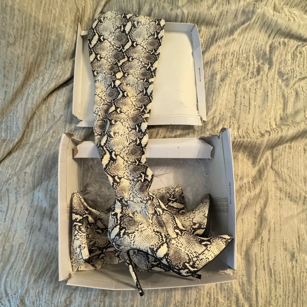 Over the knee thigh high snake print boots